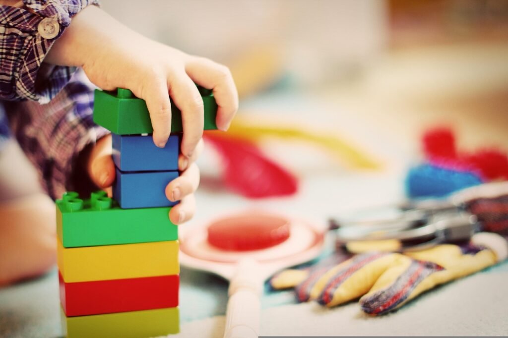 christmas background, child, tower, building blocks, blocks, wooden blocks, kindergarten, toy, children, clutter, architecture, to build, to play